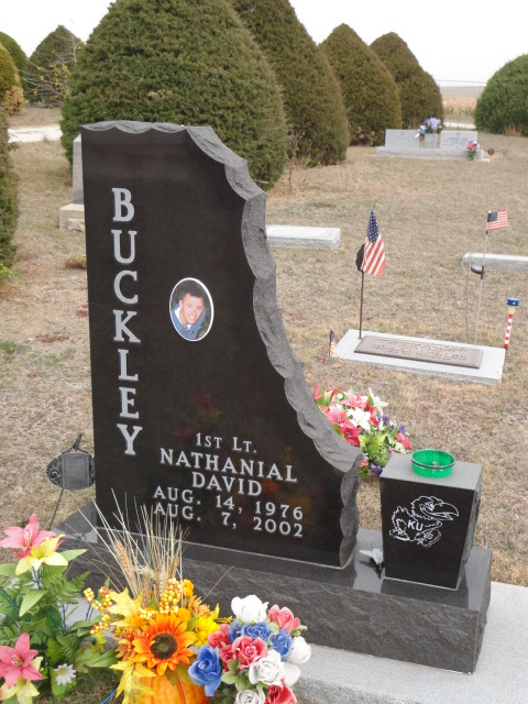 A headstone with bitemark designs