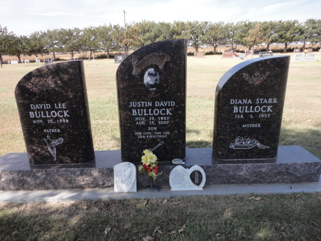 Three black headstones for a mother, father, and son