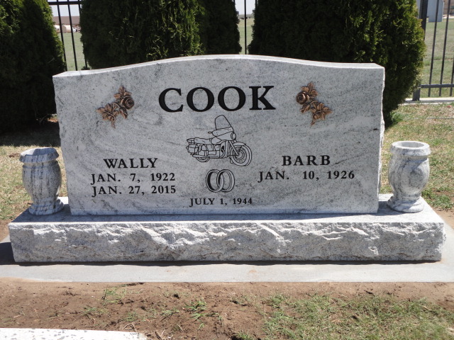 A headstone with a motorcycle design