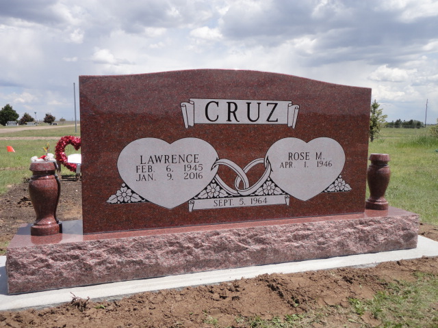 Reddish brown monument for Lawrence and Rose Cruz