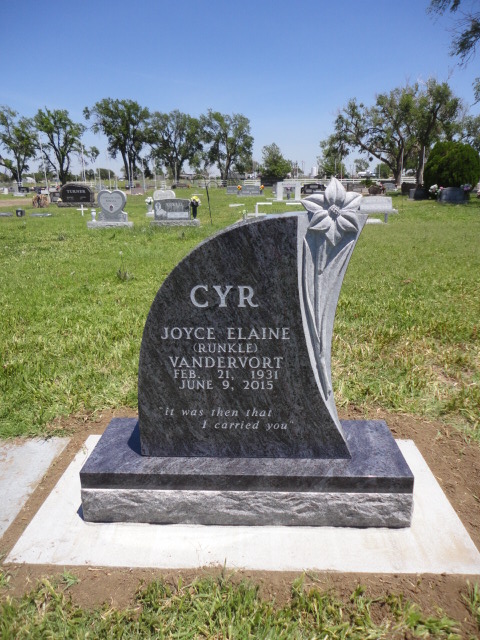 A headstone with a flower