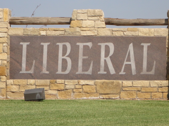 A stone wall with the word Liberal