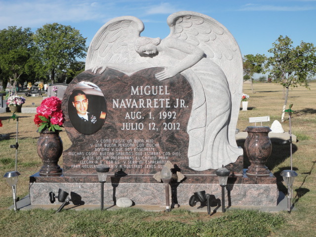 A monument for Miguel Navarette Jr. and a statue of an angel