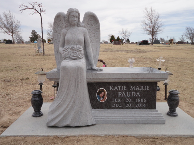 A monument for Katie Marie Pauda with an angel statue