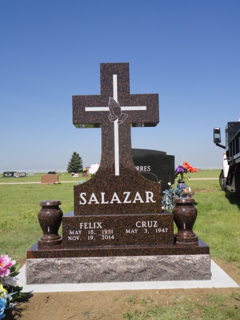 A cross-shaped headstone for Felix and Cruz Salazar